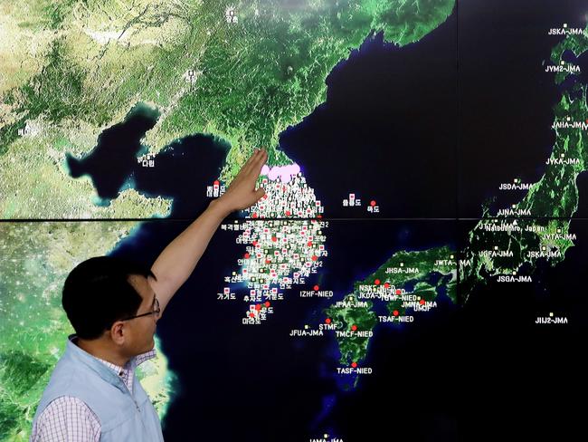 Ryoo Yog-Gyu, a Monotoring director of National Earthquake and Volcano Center, shows seismic waves taking place in North Korea on a screen at the Korea Meteorological Administration center. Picture: Getty