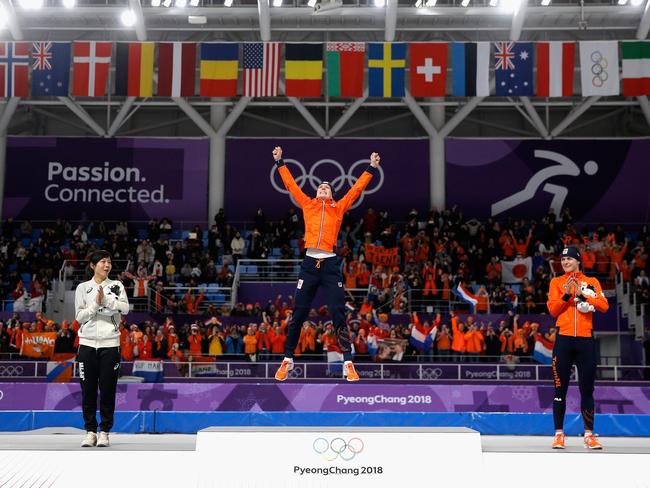 Gold medal winner Ireen Wust of The Netherlands reacts during the victory ceremony as silver medal winner Miho Takagi of Japan (L) and bronze medal winner Marrit Leenstra of The Netherlands look on after the Ladies 1,500m Long Track Speed Skating final on day three of the PyeongChang 2018 Winter Olympic Games at Gangneung Oval on February 12, 2018 in Gangneung, South Korea. Picture: Getty Images
