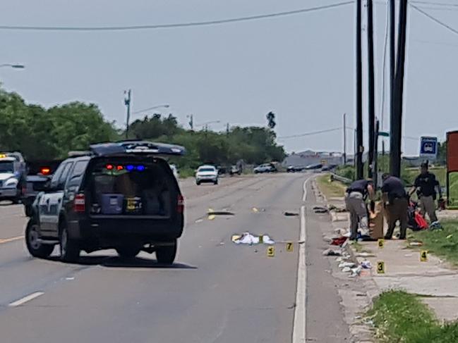 Police work at the scene after a driver crashed into several people in Brownsville, Texas, on May 7, 2023. - Seven people died and as many as six others were injured Sunday in Texas when a driver crashed into them outside a facility housing migrants in the southern US state, police said. The sport utility vehicle "ran over several people that were waiting at a bus stop" in Brownsville, a border city at the southernmost tip of Texas, local police spokesman Martin Sandoval told an ABC affiliate. (Photo by MoisÃ©s ÃVILA / AFP)