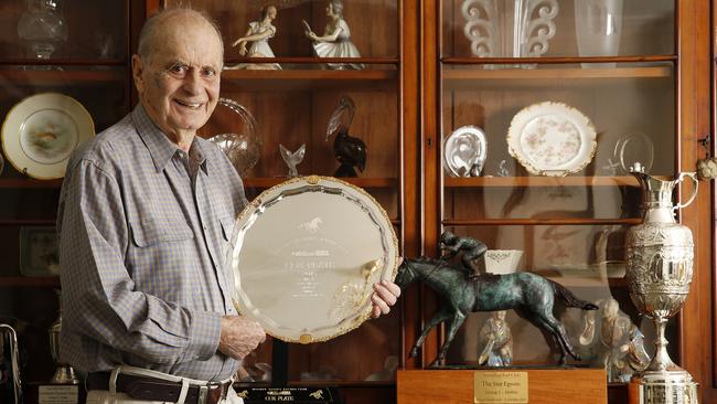 Winx co-owner Richard Treweeke with some of the spoils of his mighty mare’s achievements on the racetrack.