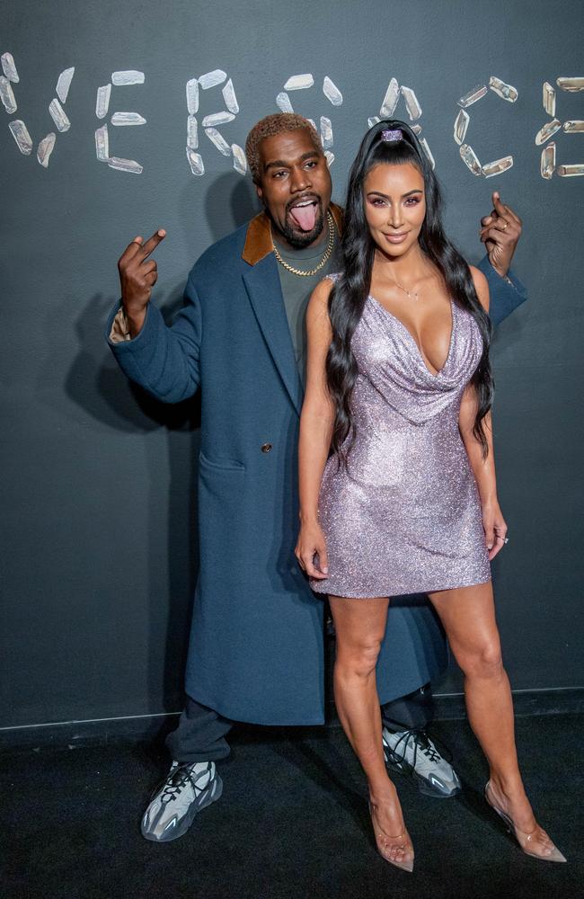 Kim Kardashian kluches Louis Vuitton and Kanye West - PurseBlog