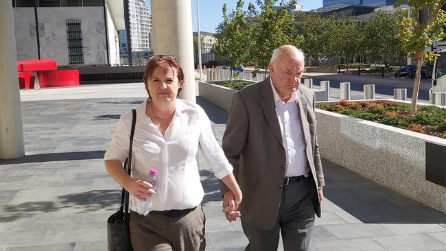 John Walter Cattle, 83 (right) leaves the ACT Supreme Court after being found guilty of historic child sex offences. Picture: Craig Dunlop