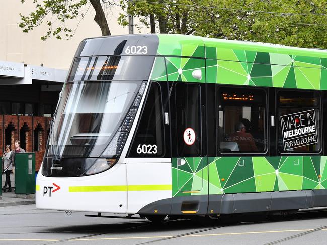 An E Class tram turns into Bourke Street in Melbourne's CBD. Picture: Jake Nowakowski