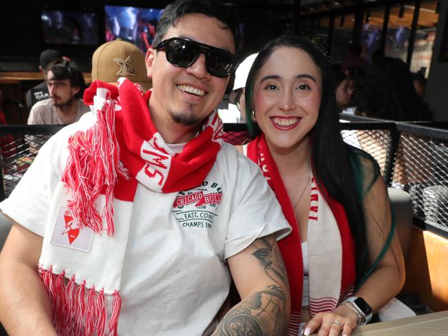 AFL grand final celebrations around Geelong . The Sporting Globe Geelong left: Walter Calderon and Milena Amaya Picture: Mark Wilson