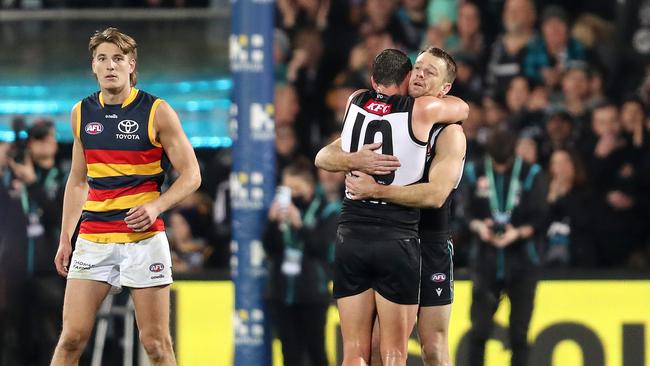 Robbie Gray and Travis Boak embrace on the final siren. Picture: Sarah Reed/AFL Photos