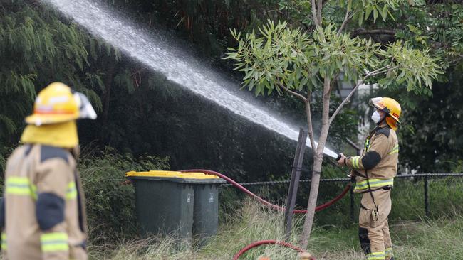 Firefighters at the scene of a house fire on Nudgee Rd in Ascot. Picture: Peter Wallis