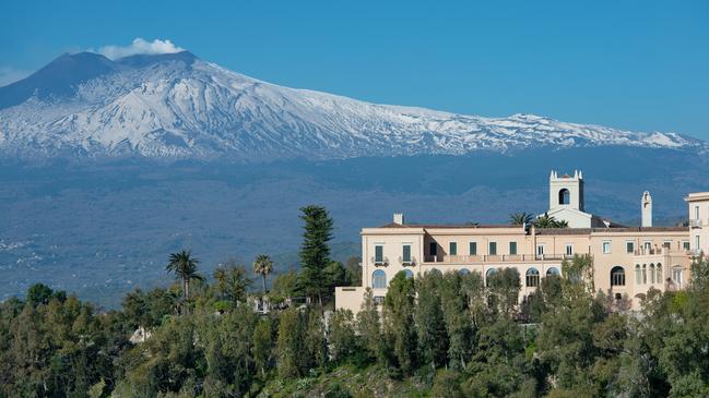 The Four Seasons hotel in Taormina with Mount Etna in the background, Sicily.