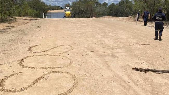 A couple aged in there 50s are lucky to be alive after they endured two terrifying nights stalked by a large crocodile after their 4WD was washed away in flood waters. Photo: LifeFlight