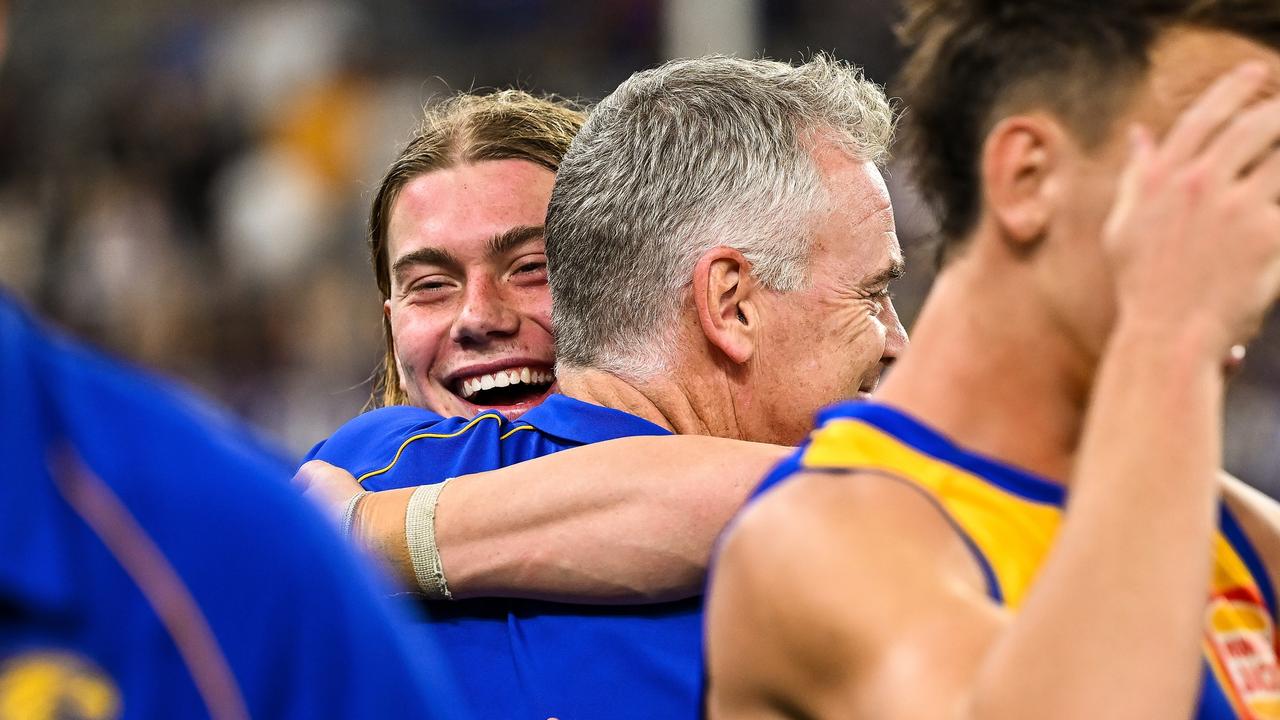 PERTH, AUSTRALIA - APRIL 20: Harley Reid embraces Adam Simpson, Senior Coach of the Eagles after the win during the 2024 AFL Round 06 match between the West Coast Eagles and the Fremantle Dockers at Optus Stadium on April 20, 2024 in Perth, Australia. (Photo by Daniel Carson/AFL Photos via Getty Images)