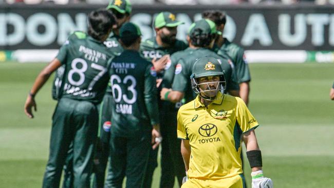 Australia's Josh Inglis leaves the field as Pakistan players celebrate his dismissal during their ODI at Adelaide Oval