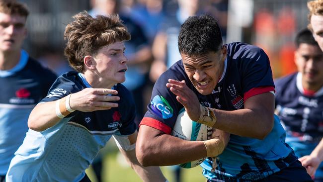 Joey Fowler tackling Rebels captain Leafi Talataina in a recent under 18s game.