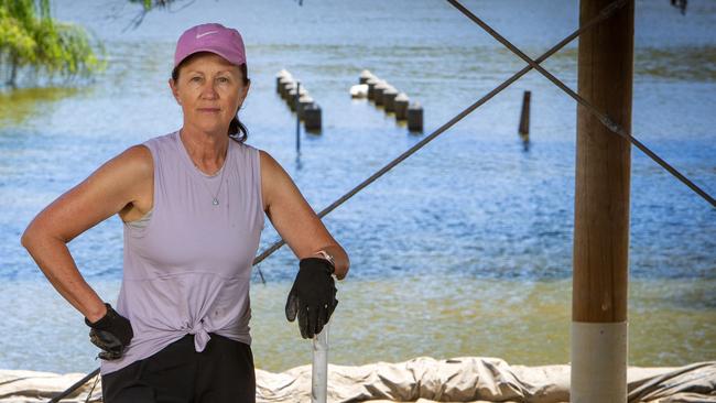 Sue Cornish cleaning up after the flooded River Murray inundated her property on Providence Drive, Bowhill. Picture Emma Brasier