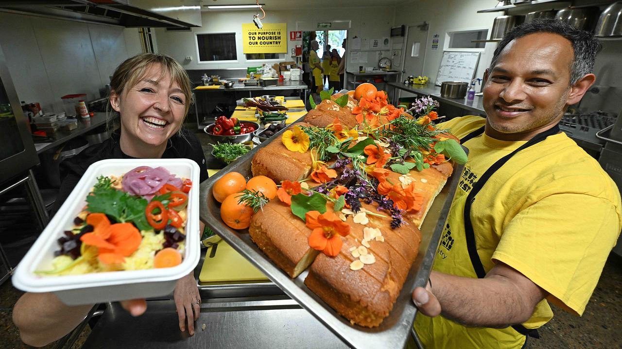 Chef Kara Kara Urbanska with Suncorp Bank’s Nick Fernando in the new kitchen where Suncorp has teamed up with OzHarvest to help fund a kitchen space in Brisbane that will provide up to an additional 52,000 cooked meals each year to help feed Queenslanders in need. Picture: Lyndon Mechielsen/Courier Mail