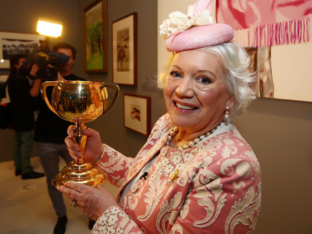 The late Lady Susan Renouf pictured with Phar Lap's Melbourne Cup, which she owned.