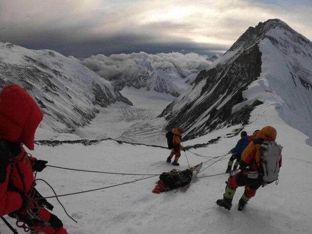 Sherpas saved Mr Lee’s life in a dramatic rescue involving a makeshift sled and a yak. Picture: China Daily