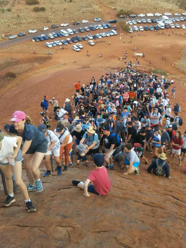 This incredible photo shows the huge number of tourists attempting to climb Uluru earlier this month before the climb closes on October 26. Picture: Supplied