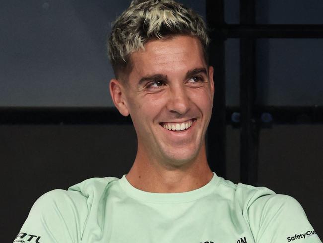 Australia's Thanasi Kokkinakis waits on his bench after a suspension due to the rain during his men's singles match against Italy's Fabio Fognini on day two of the Australian Open tennis tournament in Melbourne on January 17, 2023. (Photo by Martin KEEP / AFP) / -- IMAGE RESTRICTED TO EDITORIAL USE - STRICTLY NO COMMERCIAL USE --