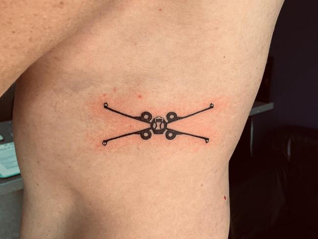 Christian Porter gets some ink done. It’s an Xwing Starfighter from Star Wars. Picture: Twitter