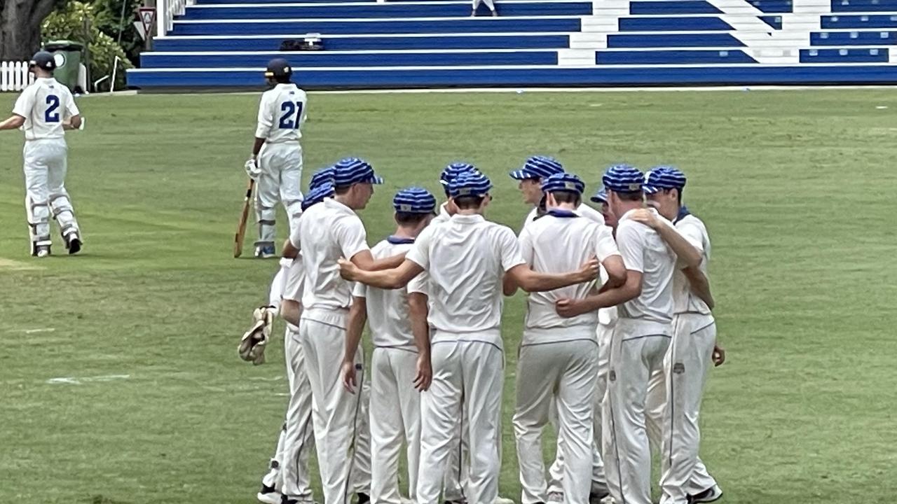 Nudgee College gather as the TGS openers walk to the crease.