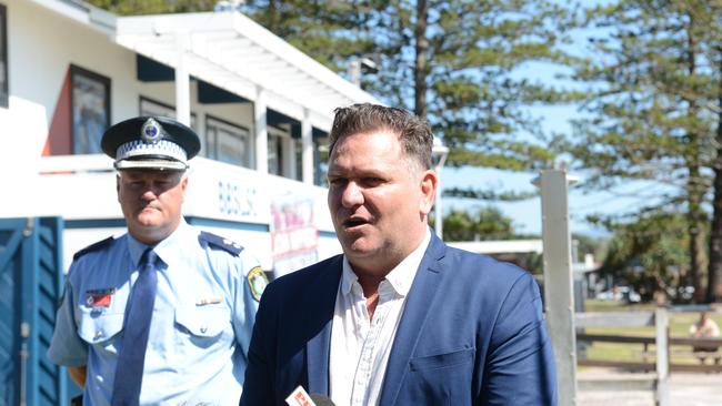 Byron mayor Simon Richardson (centre) and other local authorities have asked Year 12 graduates planning to visit Byron Bay for Schoolies to consider delaying their trip if they can.