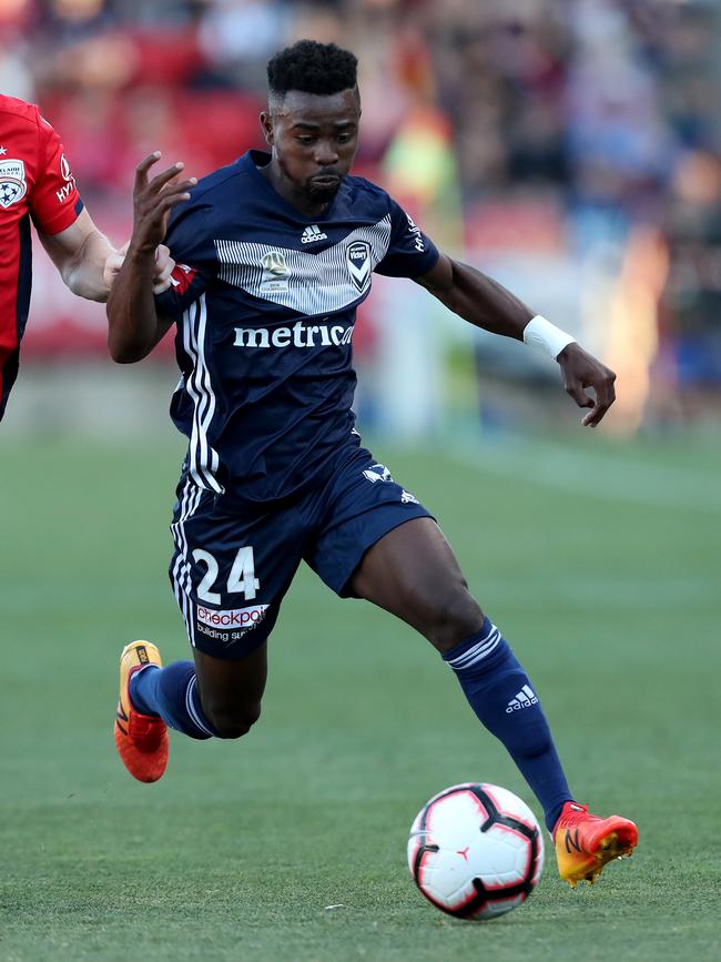 Pacifique Niyongabire of Adelaide United (left) and brother Elvis Kamsoba of Melbourne Vcitory (right) may face off this A-League season. Picture: James Elsby/Getty Images