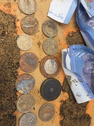 Australian and Malaysian money was found among the items on a Penang construction site. Picture: Supplied