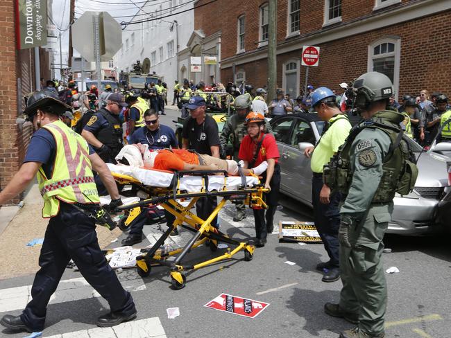 Several hundred protesters were marching in a long line when a car drove into a group of them. Picture: Steve Helber/AP