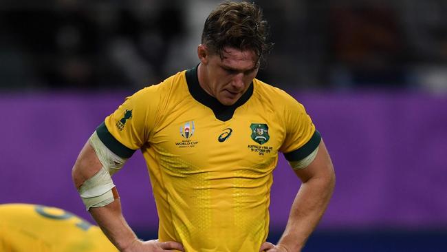 (FILES) This file photo taken on October 19, 2019 shows Australia's flanker Michael Hooper reacting after losing the Japan 2019 Rugby World Cup quarter-final match between England and Australia at the Oita Stadium in Oita. - With the Wallabies languishing at seventh in the world rankings, Rugby Australia's leadership in flux and the sport facing fierce competition from other codes, the coronavirus pandemic in 2020 has turned long-standing problems with rugby Down Under into a battle for survival. (Photo by CHARLY TRIBALLEAU / AFP)