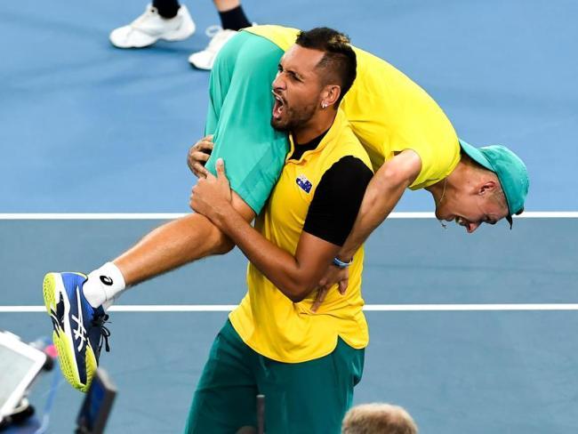 Nick Kyrgios carries his "little bro".