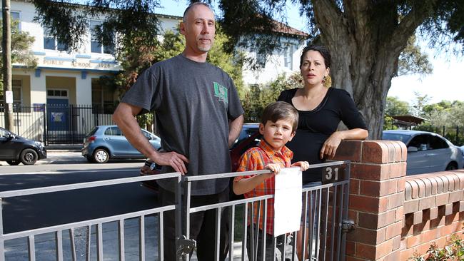 Matt Burke with his wife Maria Fernandez and son Alex lives across the street from Ashbury Public School and often gets parked in by parents,