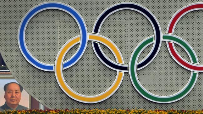 A portrait of Mao Zedong is seen behind the Olympic rings in Tiananmen Square at the 2008 Games in Beijing.