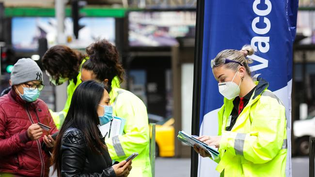 A general view of people lining up to get a Covid-19 vaccine at the pop up Vaccination Hub on Pitt Street in the CBD in Sydney. Picture: NCA NewsWire /Gaye Gerard