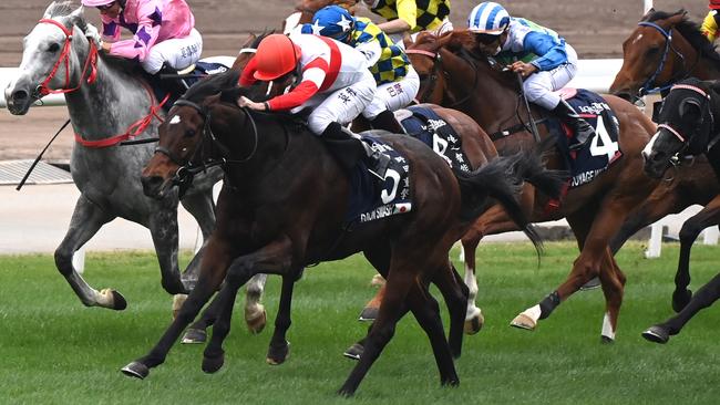 Danon Smash (red and white) under Ryan Moore wins the Hong Kong Sprint International at Sha Tin. Picture: AFP