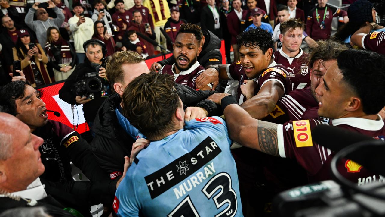 Cameron Murray wrestles Queensland players. NRL photos