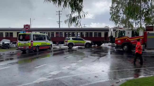 Emergency Services attend the scene of a crash on Collins Ave where a car crashed into a Kuranda Scenic Rail train carriage.