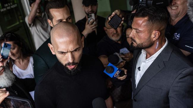 Andrew Tate took aim at the media scrum. (Photo by Alon Skuy / GETTY IMAGES NORTH AMERICA / Getty Images via AFP)