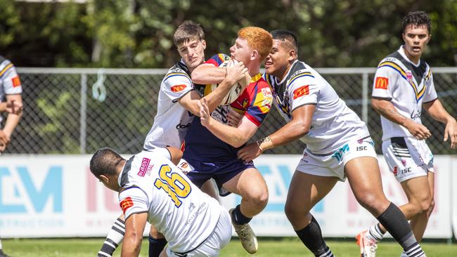 Sam Gillespie is tackled in the QRL Mal Meninga Cup game between Souths Logan Magpies and Western Mustangs. Photo: AAP Image/Renae Droop