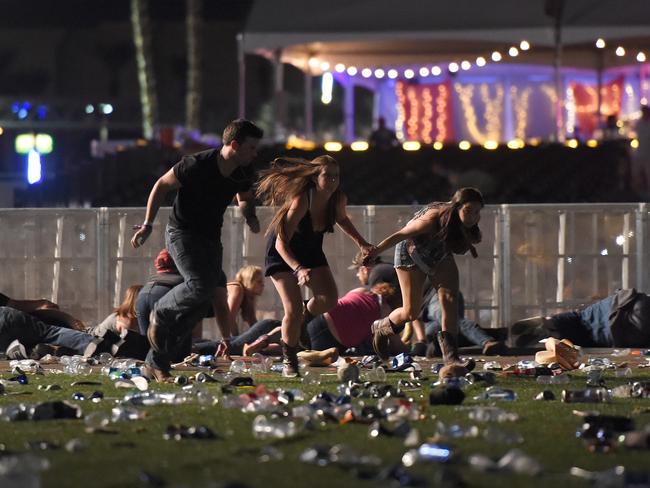 People run from the Route 91 Harvest country music festival after gun fire was heard. Picture: David Becker/Getty Images/AFP / AFP PHOTO / GETTY IMAGES NORTH AMERICA / David Becker