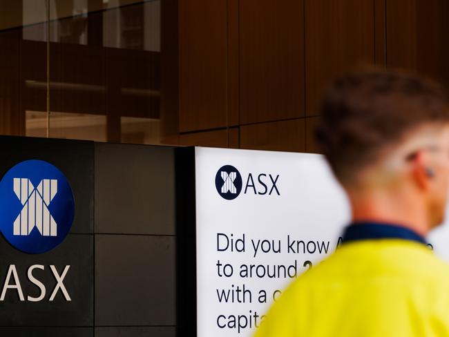 SYDNEY, AUSTRALIA - NewsWire Photos, October 29 2024. GENERIC. Stocks. Finance. Economy. A man in hi vis clothing walks past the Australian Stock Exchange, ASX, on Bridge Street. Picture: NewsWire / Max Mason-Hubers