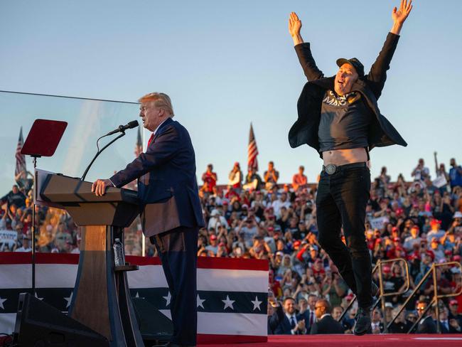 Tesla and SpaceX CEO Elon Musk (R) jumps on stage as he joins Donald Trump (L) during a campaign rally in Butler, Pennsylvania on October 5, 2024. Picture: AFP