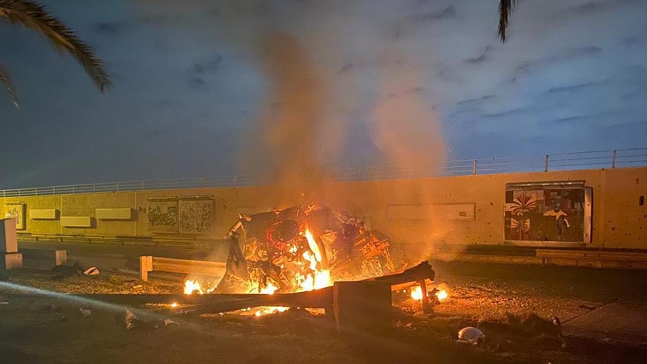 A burning vehicle at the Baghdad international airport following an air strike on January 3. Iraqi Prime Minister Press Office via AP