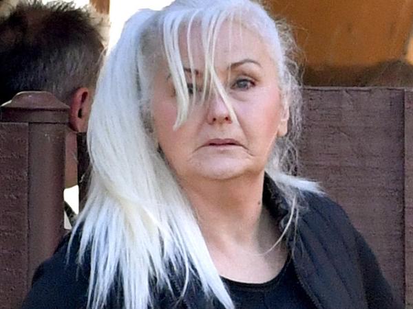 Wendie-Sue Dent (centre) is seen at a viewing of the crime scene at Morphett Vale, Adelaide, Monday, July 22, 2019. Ms Dent is on trial charged with the murder of her de facto husband David Lawrence in December 2015. (AAP Image/Sam Wundke) NO ARCHIVING