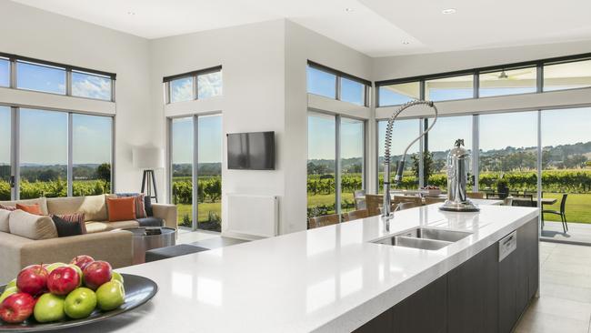 The state-of-the-art kitchen enjoys stunning views.