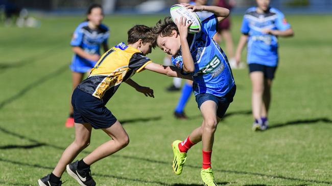 Bodhi Martin of Rockville State School gets a touch on Raiyn Hunt of Middle Ridge State School in the inaugural Primary Interschools Reconciliation Touch Carnival hosted by Glenvale State School, Wednesday, May 28, 2025. Picture: Kevin Farmer