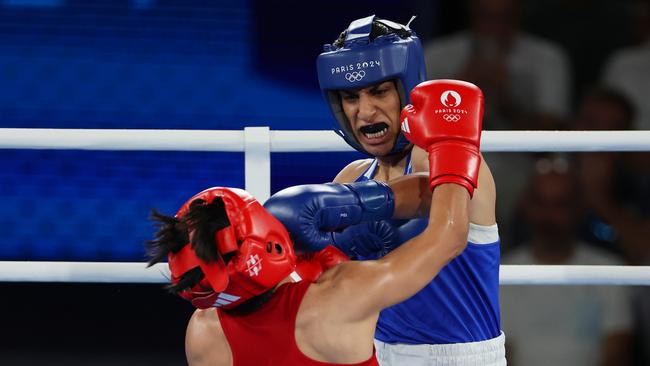 PARIS, FRANCE - AUGUST 06: Imane Khelif of Team Algeria punches Janjaem Suwannapheng of Team Thailand during the Women's 66kg Semifinal round match on day eleven of the Olympic Games Paris 2024 at Roland Garros on August 06, 2024 in Paris, France. (Photo by Matthew Stockman/Getty Images) *** BESTPIX ***