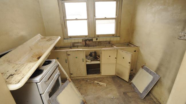 The kitchen of this original Merrylands home is dilapidated and useless.  Picture: Phil Rogers