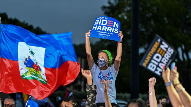 People cheered at Obama’s drive in rally in Miami, Florida. Picture: Chandan Khanna/AFP