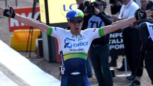 Mat Hayman celebrates crossing the finish line in the Paris-Roubaix one-day classic.I