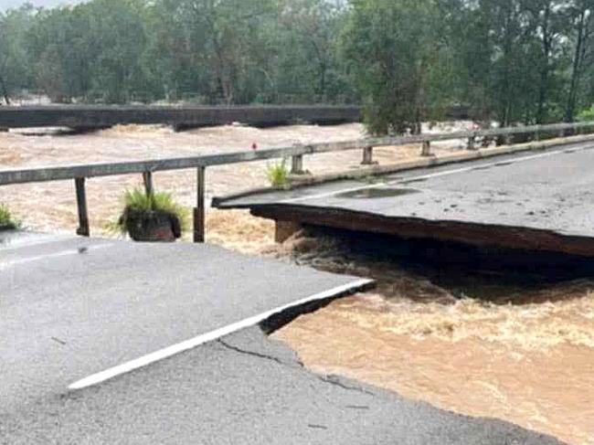 Ollera Creek Bridge cut in half from flood water on the Bruce Highway north of Townsville.