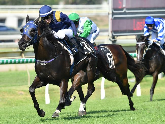 Jockey Jeff Lloyd (left) rides Betaima to victory in race 5, the Brisbane Broncos Sizzling Plate during Brisbane Broncos Race Day at Doomben Racecourse in Brisbane, Saturday, December 1, 2018. (AAP Image/Darren England)